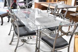 An Italian designer style glass top table with burnished metal frame and set of six (four plus
