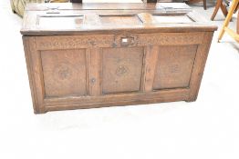 A period oak three panel coffer of nice proportions, having rosette carvings to panels and
