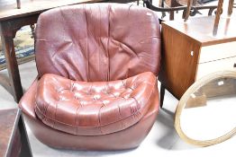 A vintage brown leather egg style easy chair, probably Namco, missing base, full re-upholstery