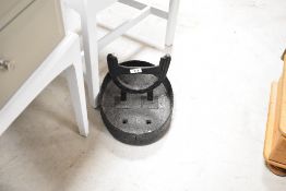 A cast iron boot scraper