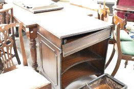 A reproduction mahogany style computer desk, the rectangular top with inset red-stained and gilt