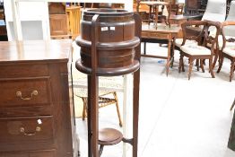An early 20th Century dark stained barrel style jardiniere stand , height approx. 122cm