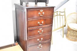 A reproduction Regency three drawer filing cabinet, disguised as a narrow six drawer chest