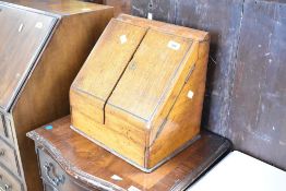 A Victorian oak stationery box, having fitted interior (af) and discrete drawer to base, width