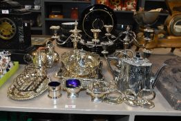 A selection of late 19th to early 20th-century metal and EPNS ware, to feature three candlesticks,