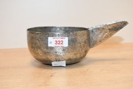 A presumed 19th-century white metal Omani (Bahla) camel milking bowl, featuring hand engraved floral