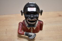 A mid 20th-century Starkies painted metal 'Jolly Gent' mechanical money bank, featuring a lever that