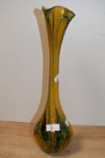 A tall contemporary Ourglass studio glass tear drop vase, having a softly flared rim with a long