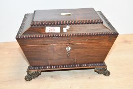 A Victorian mahogany jewellery box of sarcophagus form, featuring a monogrammed shield to the top;