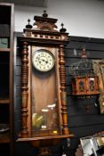 A fine 19th-century Vienna-style walnut cased wall clock, featuring an 8-day gong striking movement,