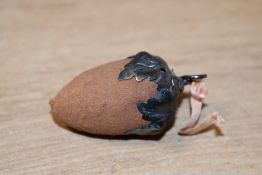 A late 19th-century white metal and fabric acorn pin cushion, thought to be American, featuring