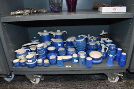 A large quantity of 20th-century Devon Blue Pottery, featuring various British town names, to