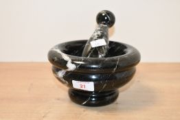 A heavy contemporary veined stone pestle and mortar, presumed to be black marble, unmarked, 16.5cm