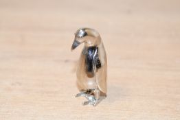 A small contemporary Saturno-style white metal penguin, unmarked, 5cm, condition is consistent