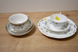 Two 19th-century French-style porcelain tea cup trios; to both feature delicate blue floral