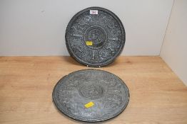 Two late 19th to 20th-century metal cast 'Temperantia'-style decorative plates, featuring