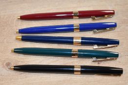 Five Sheaffer Imperial ballpoint pens in Green,, Red, Black, Blue, and Dark Blue