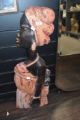 A large 20th-century African Tribal Art wooden wall decoration, featuring a hand carved female