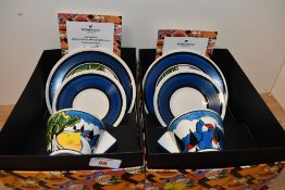 Two contemporary Clarice Cliff Bizarre teacup, saucer and side plate sets by Wedgwood, to feature