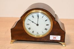 A small 20th-century Harrison and Son mahogany and brass mantel clock, featuring a circular brass