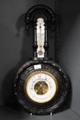 A 19th-century German Lufft dark wood banjo-style barometer and thermometer, featuring a