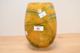 A contemporary Ourglass studio glass vase, having swirled yellow and blue detailing, etched to base,