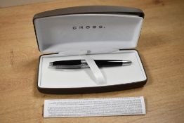 A boxed Cross Apogee Black Star rollerball pen in Black