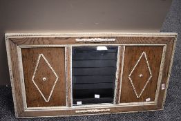 A large late 20th-century panelled wooden wall mirror, having a light wood finish and decorative