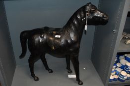 A large early 20th-century Liberty of London-style leather horse, featuring hand stitched