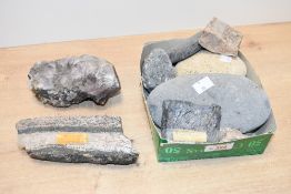 A selection of assorted natural rocks and mineral specimens, including raw, more natural examples,