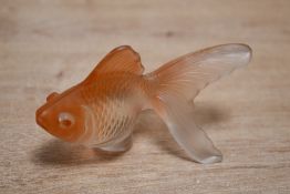 Thought to be mid 20th-century moulded glass goldfish figurine, with soft orange accents,