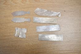 A fine selection of 19th-century mother-of-pearl game tokens, to feature three delicately engraved