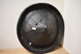 Of ethnographic interest, a presumed large 20th-century Ethiopian hide shield, of conical form,