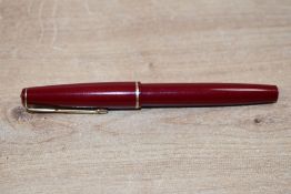 A Parker 17 Lady aerometric fill fountain pen in red with gold trim
