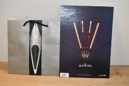 A vintage cardboard Sheaffer fountain pen advertising stand, with a easel back; sold with a Sheaffer