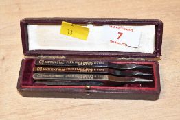 A set of three early 20th-century John Brinsmead and Sons of London metal piano tuning forks,