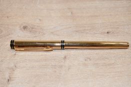 A Waterman Exclusive cartridge fill fountain pen in gold plated Godron pattern having Waterman Ideal