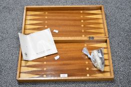 A vintage German wooden Backgammon and Jacquet set, featuring an inlaid wooden board with a hinged