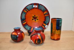 A selection of 20th-century Poole 'Volcano' pottery, featuring colourful reactive glazes of