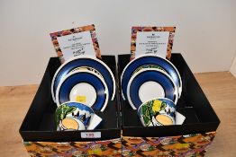 Two contemporary Clarice Cliff Bizarre teacup, saucer and side plate sets by Wedgwood, to feature