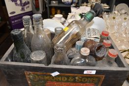 A selection of late 19th to early 20th-century industrial-style glass bottles, to feature examples