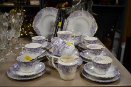A Victorian Asbury Longton china part tea set, featuring light purple transferware of foliate,