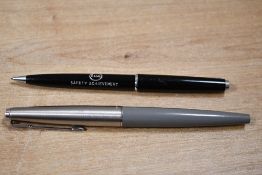 A Parker 45 fibre tip pen in grey and Esso advertising propelling pencil in black