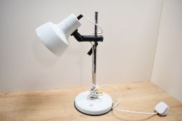 A vintage British Home Stores metal desk lamp, featuring an adjustable spotlight head and a