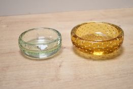 Two mid 20th-century Whitefriars glass controlled bubble glass bowls, featuring a light green and