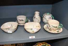 A 19th/20th-century Japanese-style earthenware tableware, to feature delicate hand painted bird