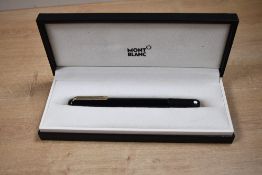 A boxed Montblanc M roller ball pen in gloss Black with magnetic cap close