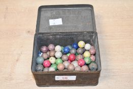 A quantity of mid to late 19th-century clay marbles, of varying colours and sizes, to include one