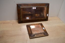 Of local interest, two early 20th-century Arts and Crafts wood and copper hot plates from the