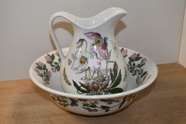 A 20th-century Portmerion pottery 'Christmas Rose' ewer and basin set, designed by Susan Williams-